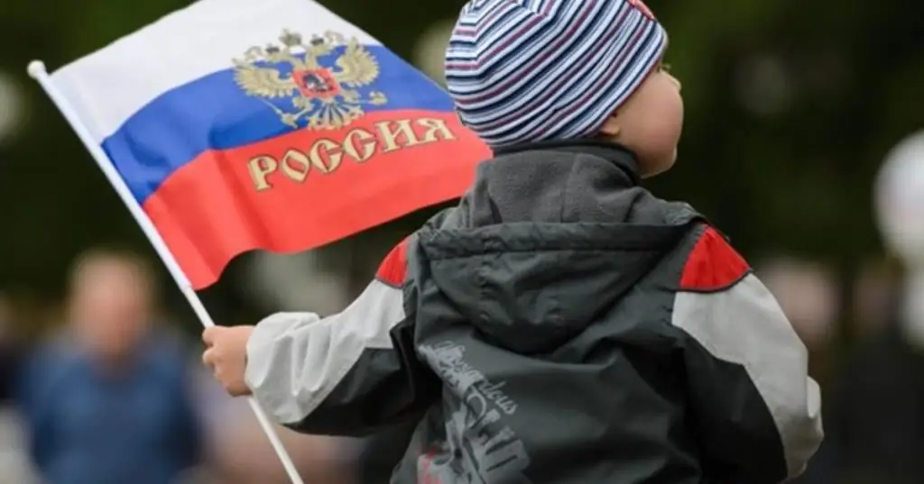 boy holding a flag